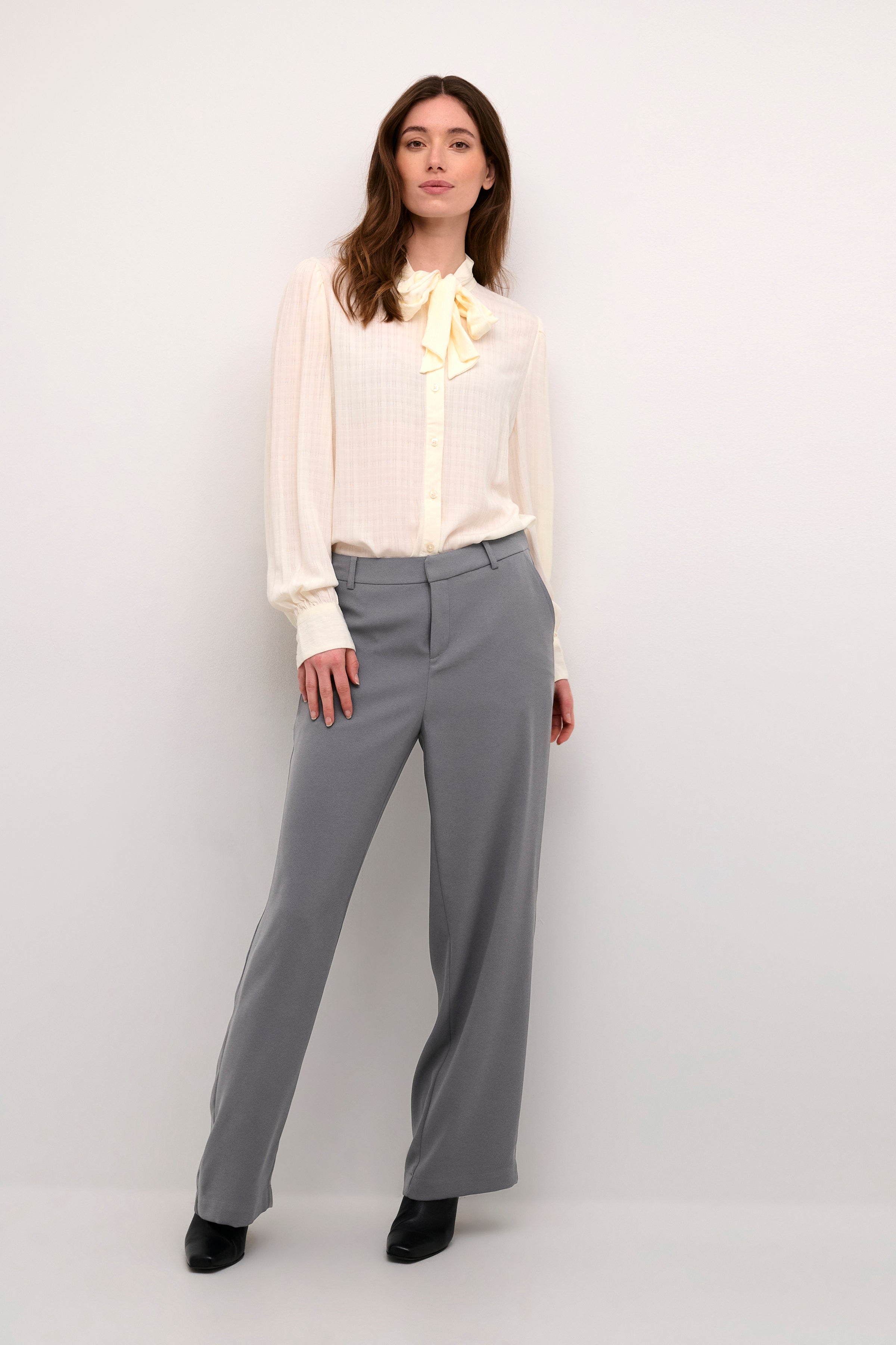 The Cream Cocamia Pant is a versatile and stylish addition to any wardrobe. This pant offers a sleek and sophisticated look, and the zip and button closure, along with the elastic back waist, provide a comfortable fit for all-day wear. Complete with pockets and belt loops, this pant offers both style and functionality.