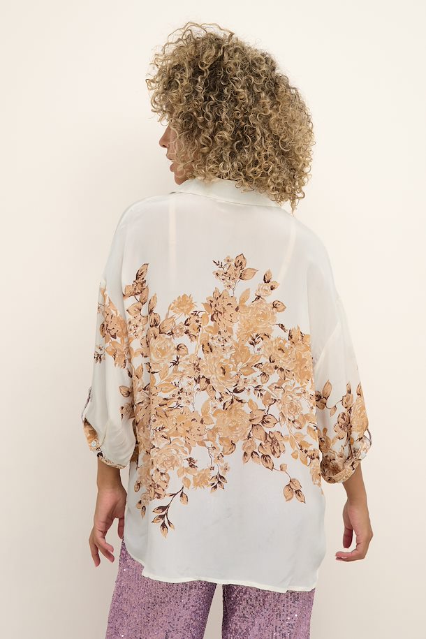 Make a statement with this Cream Cyrina OZ Shirt! Perfect for everyday, this oversize fit mid thigh length garment is made of 100% Viscose, making it soft and comfortable yet amazingly stylish. 
