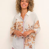 Make a statement with this Cream Cyrina OZ Shirt! Perfect for everyday, this oversize fit mid thigh length garment is made of 100% Viscose, making it soft and comfortable yet amazingly stylish. 
