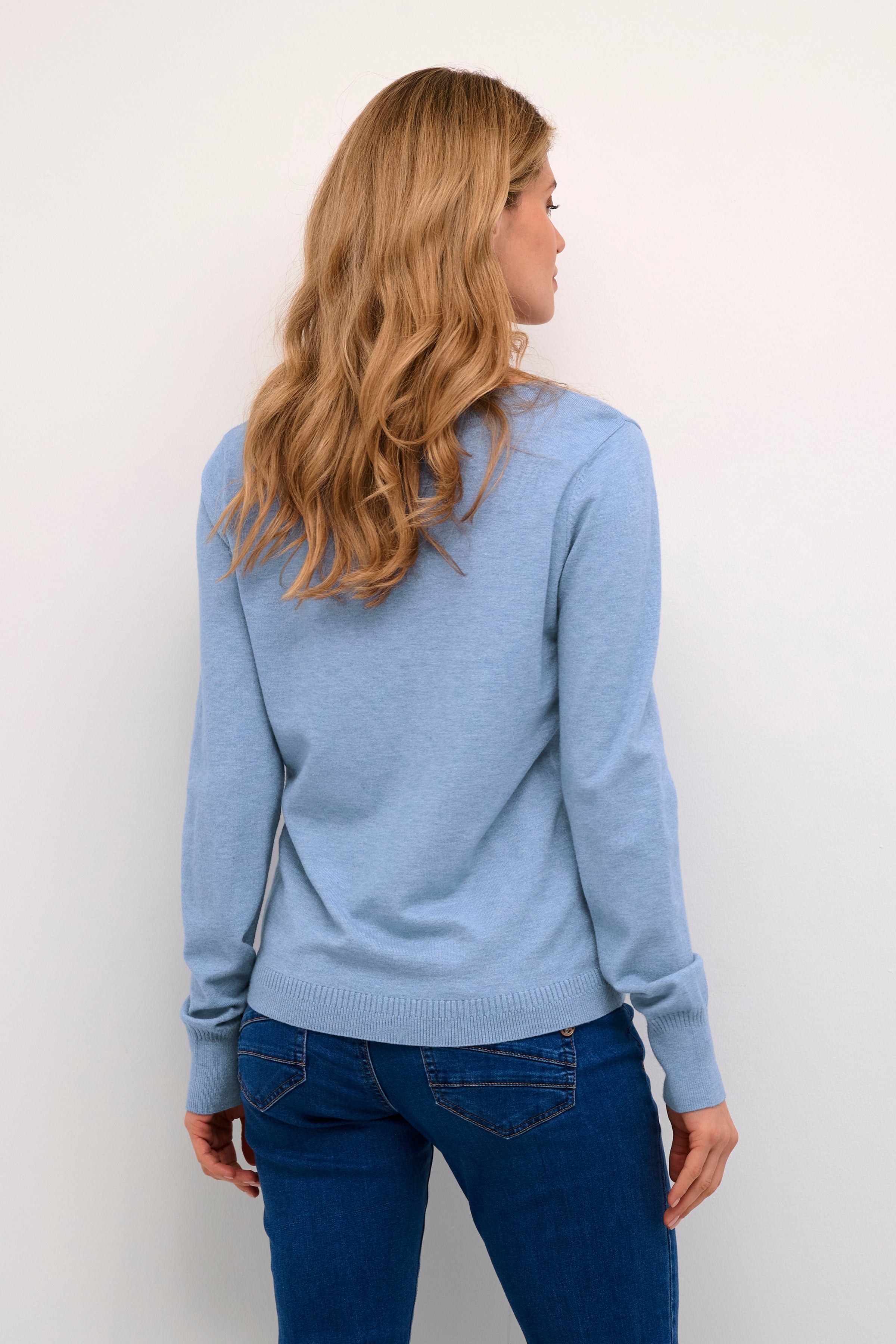 The Cream Dela Knit Pullover is a must-have for any wardrobe. Its lightweight design ensures comfort and ease, while the soft, casual style adds a touch of luxury. The v neck detail adds a subtle, yet elegant touch to any outfit. Elevate your style with this versatile and effortlessly chic piece.