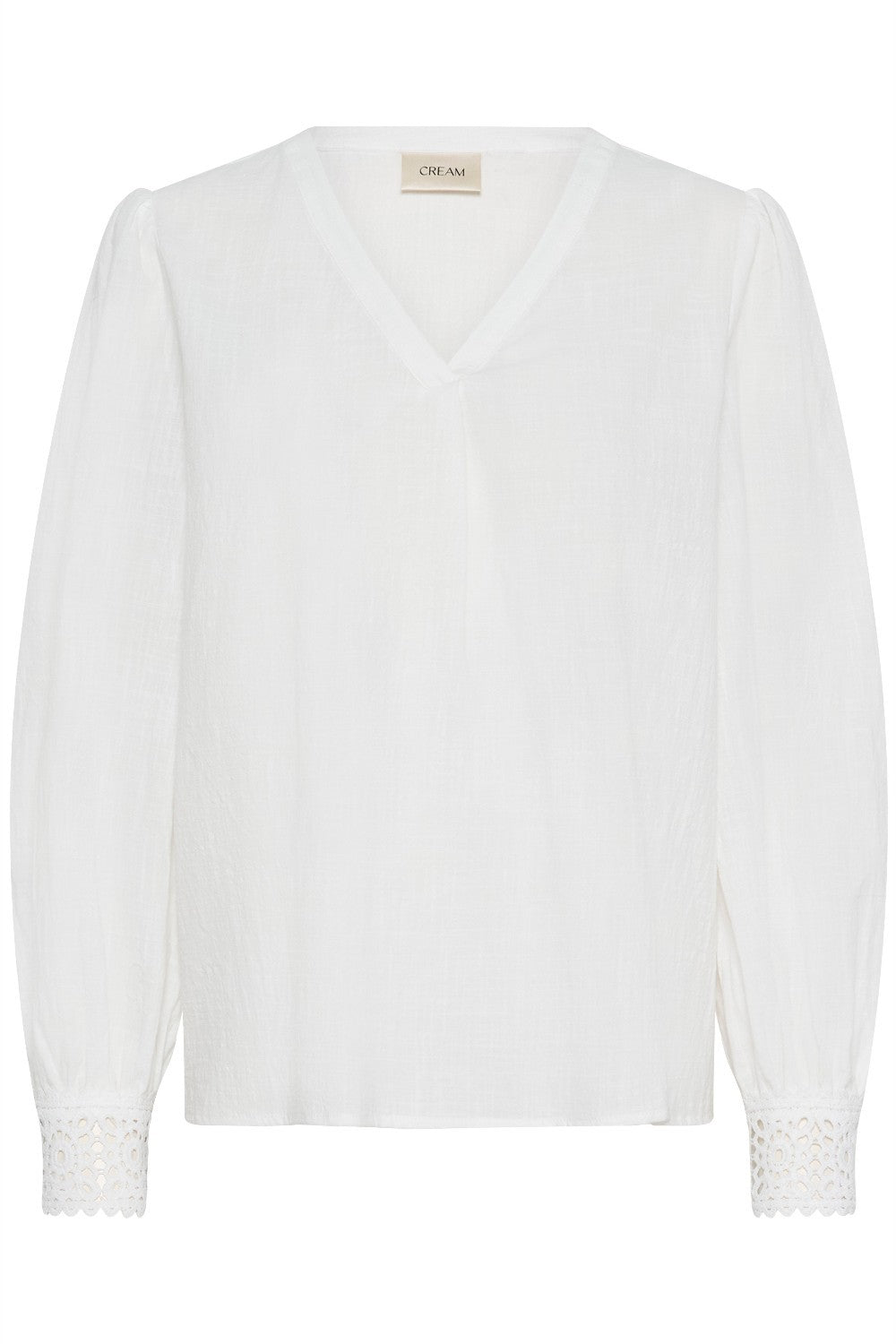 White blouse with lace details on a white background