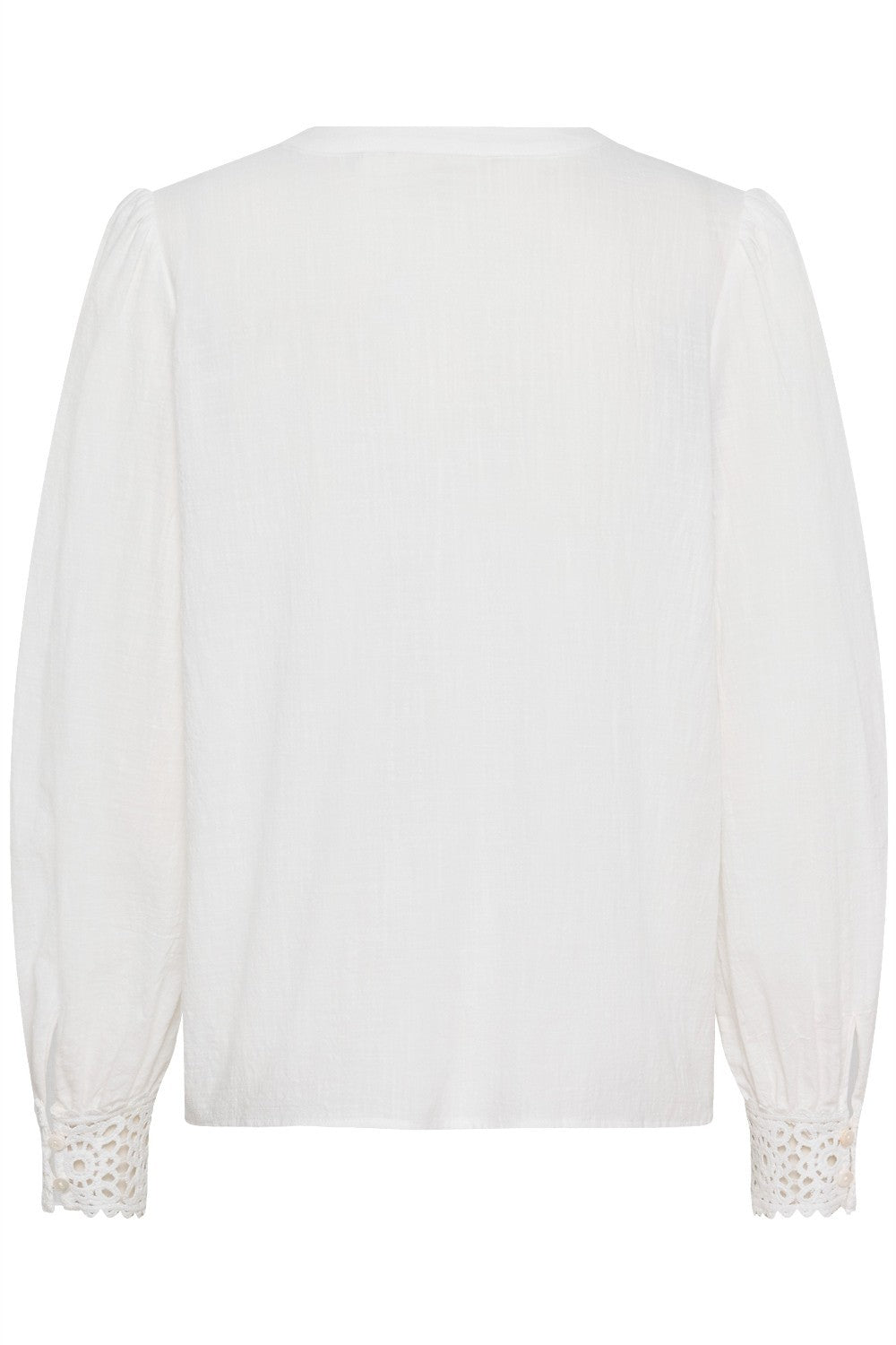 White blouse with lace details on cuffs and hem against a white background