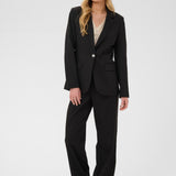Woman wearing a black suit on a white background