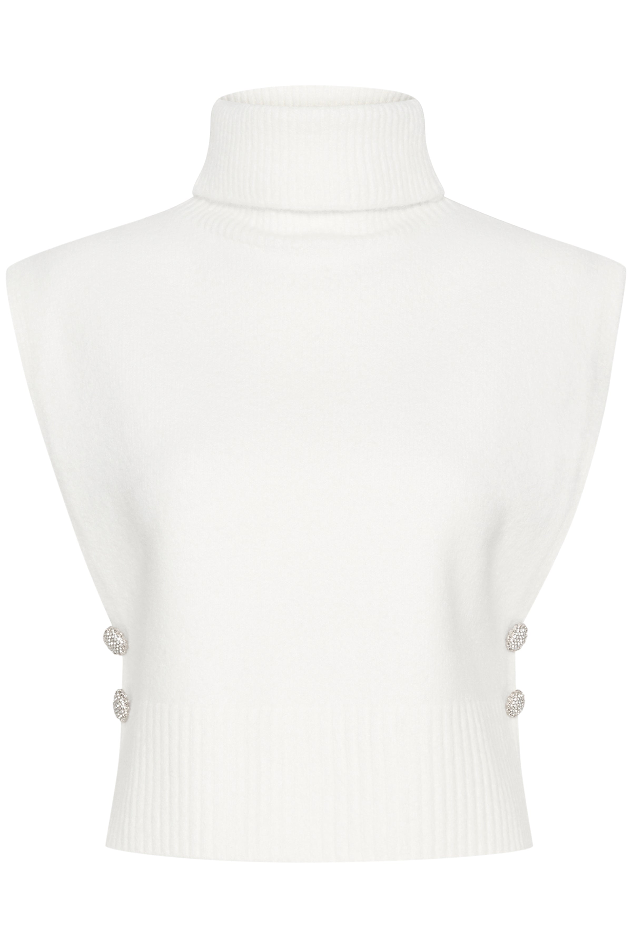 This Cream Ginger Knit Slipover adds a stylish layer to any outfit. The striking design and soft material make it a versatile choice for any occasion. With beautiful side buttons, it's both functional and fashionable. Elevate your wardrobe with this must-have piece.