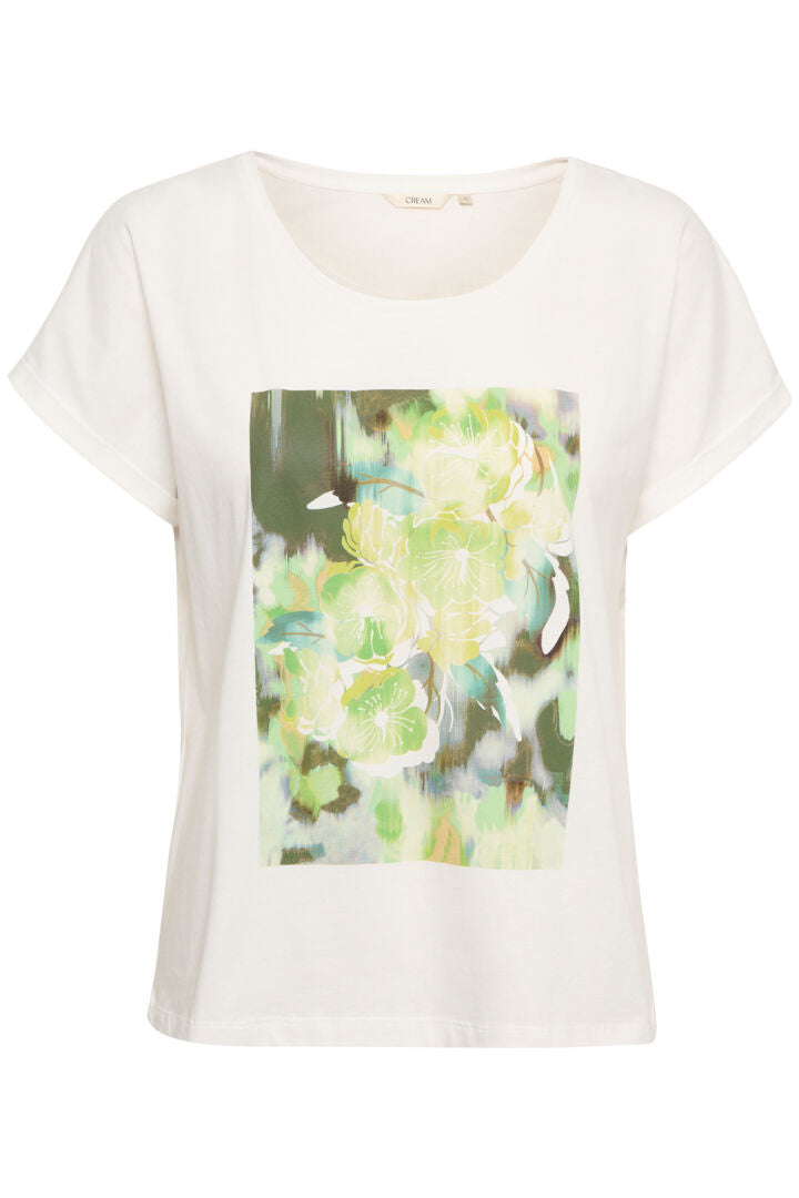 Stay cool and stylish with our Cream Irma T-Shirt. Made from 100% cotton, this tee features a vibrant green flower print. Perfect for any casual occasion, this shirt will become a staple in your wardrobe. (Seriously, it's a must-have!)