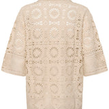 Beige crochet top on a white background