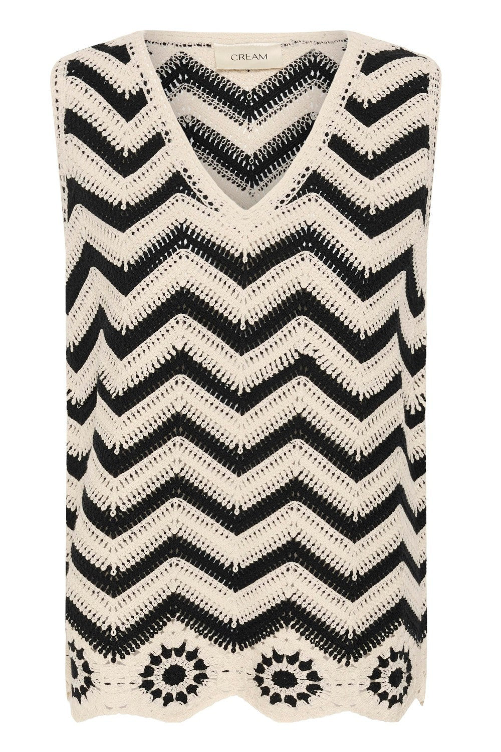Black and white zigzag patterned sleeveless top on a white background