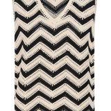 Black and white zigzag patterned sleeveless top on a white background