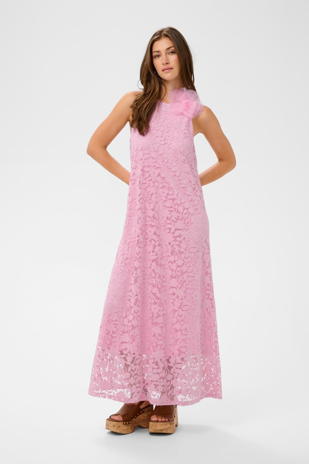 Woman wearing a pink dress on a white background