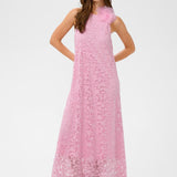 Woman wearing a pink dress on a white background