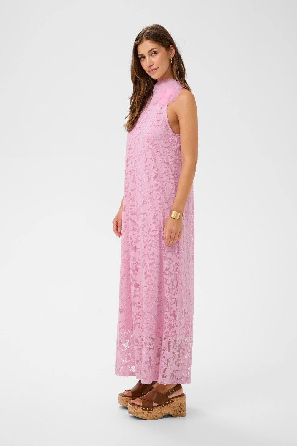 Woman wearing a pink dress on a white background