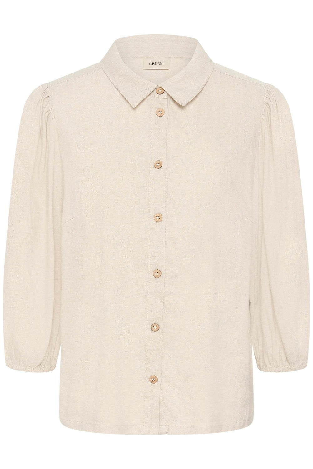 Effortless elegance meets comfort in this linen blend shirt. Crafted from a breathable linen mix, it is cool and drapes beautifully. The subtle puff shoulder adds a touch of refined detail without overwhelming the silhouette—a timeless piece.