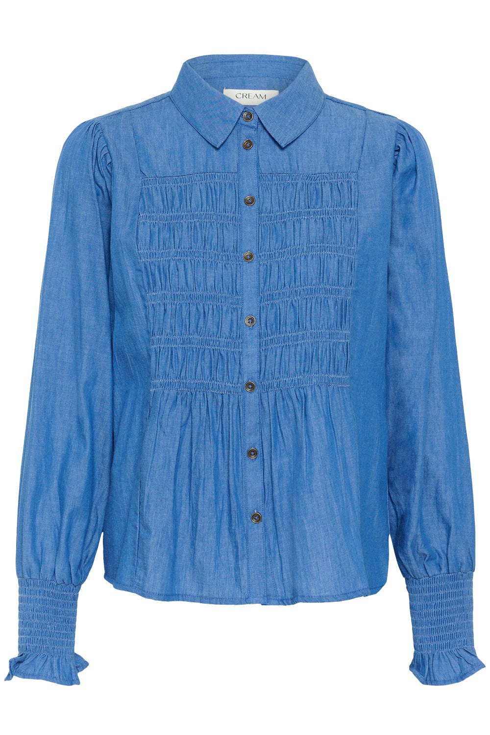Blue shirt with smocked details on a white background