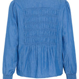 Blue shirt with smocked details on a white background