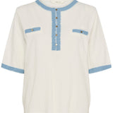 White blouse with blue accents on a white background