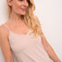 The Cream Lissandra Sliptop is an essential everyday cami designed for versatile layering. This sophisticated piece provides extra coverage beneath sheer tops while maintaining a sleek silhouette. The neutral tone ensures seamless integration with your existing wardrobe, making it an indispensable foundation garment for creating polished, layered ensembles.