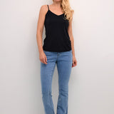 The Cream Lissandra Sliptop is an essential everyday cami designed for versatile layering. This sophisticated piece provides extra coverage beneath sheer tops while maintaining a sleek silhouette. The neutral tone ensures seamless integration with your existing wardrobe, making it an indispensable foundation garment for creating polished, layered ensembles.