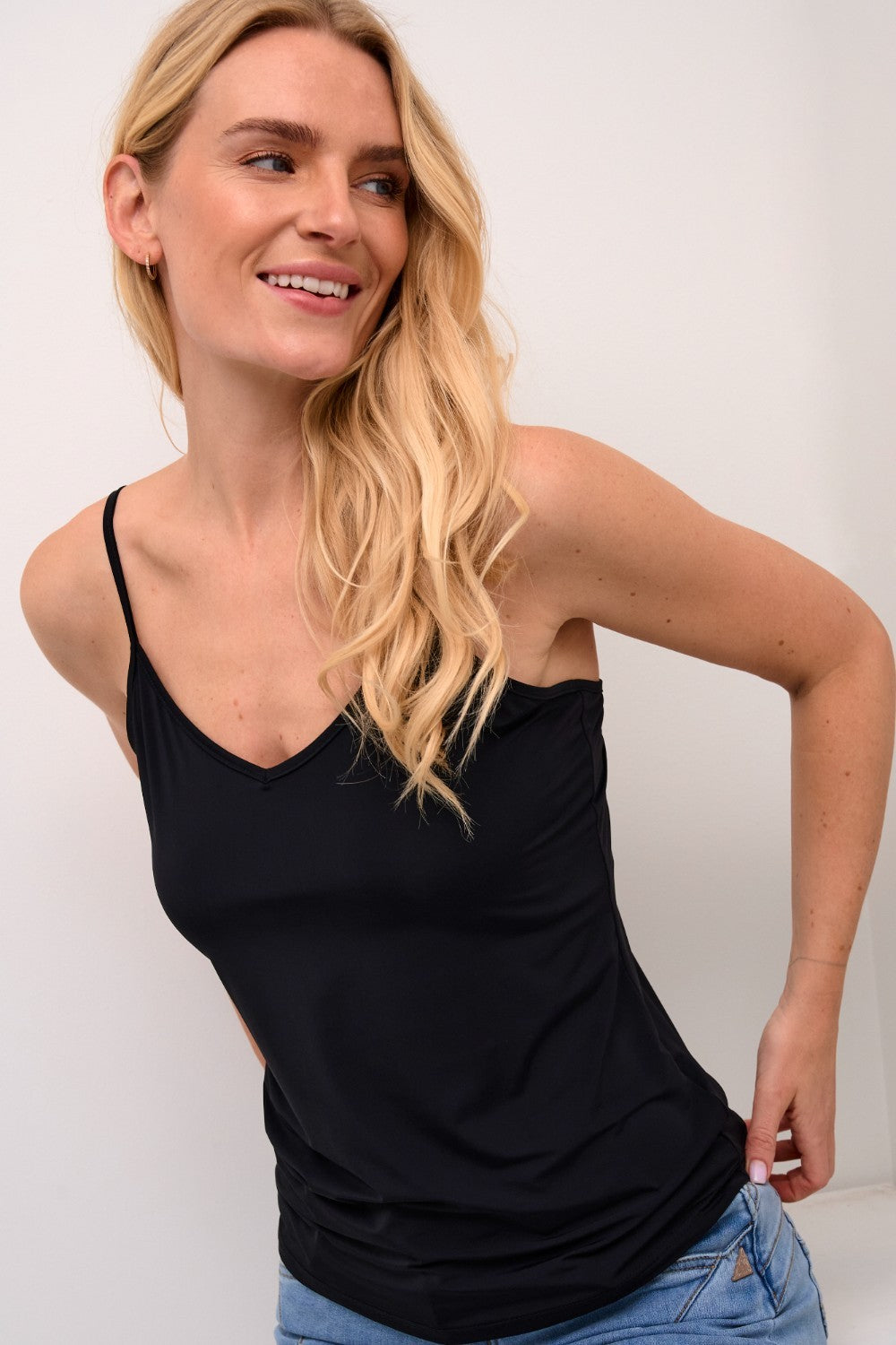 The Cream Lissandra Sliptop is an essential everyday cami designed for versatile layering. This sophisticated piece provides extra coverage beneath sheer tops while maintaining a sleek silhouette. The neutral tone ensures seamless integration with your existing wardrobe, making it an indispensable foundation garment for creating polished, layered ensembles.