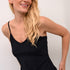 The Cream Lissandra Sliptop is an essential everyday cami designed for versatile layering. This sophisticated piece provides extra coverage beneath sheer tops while maintaining a sleek silhouette. The neutral tone ensures seamless integration with your existing wardrobe, making it an indispensable foundation garment for creating polished, layered ensembles.