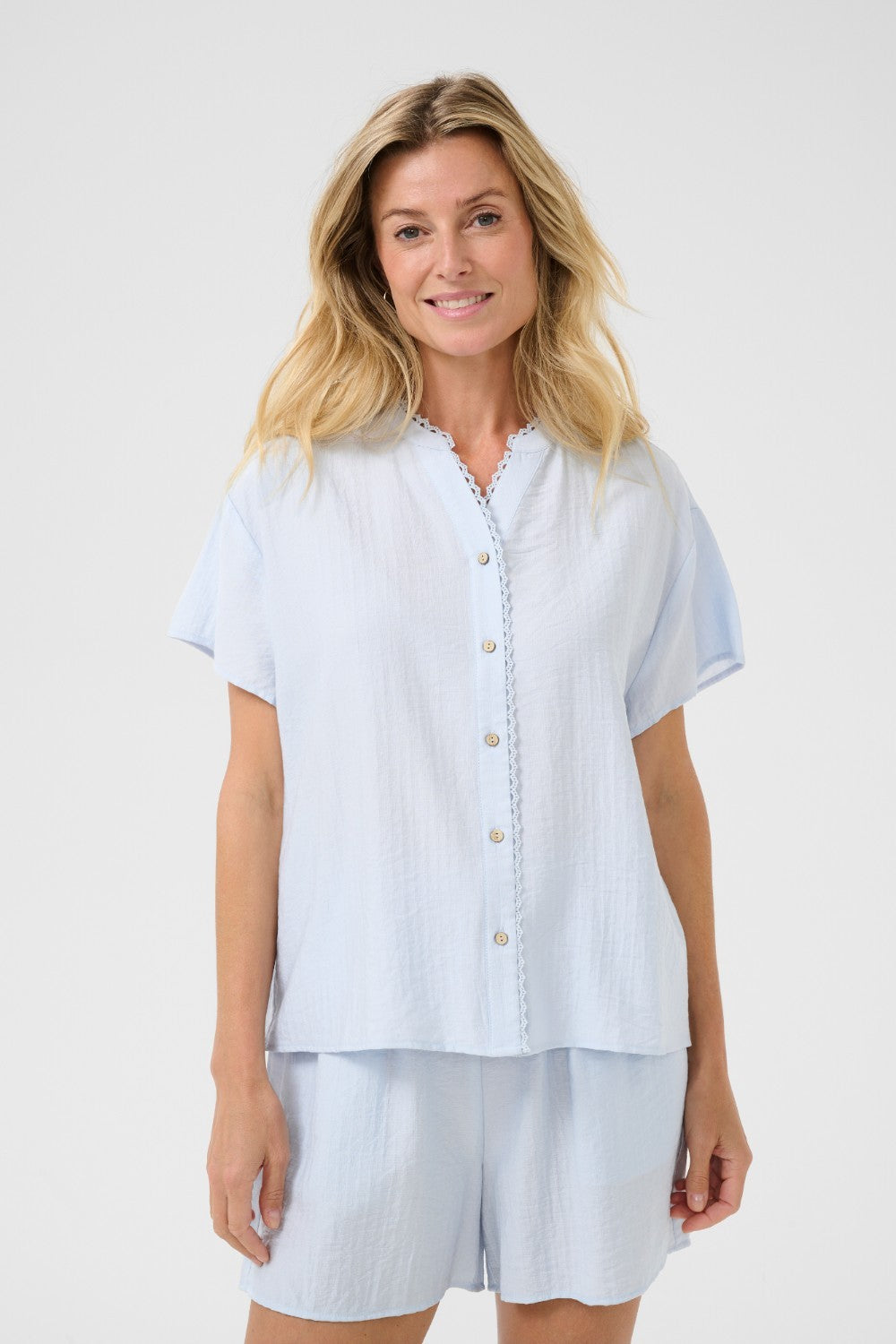 Effortlessly elevate your wardrobe with our Cream Lori Lace Shirt. This lightweight, full button front shirt makes for an easy and stylish addition to any outfit. The subtle lace detailing adds a touch of elegance, perfect for most occasions.