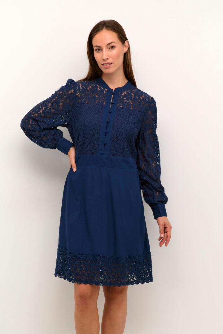 Introducing the Cream Milla Kaspis Dress! Featuring a Zally Fit for a flattering silhouette, Dress Blues for a sophisticated touch, and delicate lace for a feminine touch. Perfect for any occasion with its versatile Long Sleeve design. Add elegance to your wardrobe today!  85% Cotton / 15% Nylon