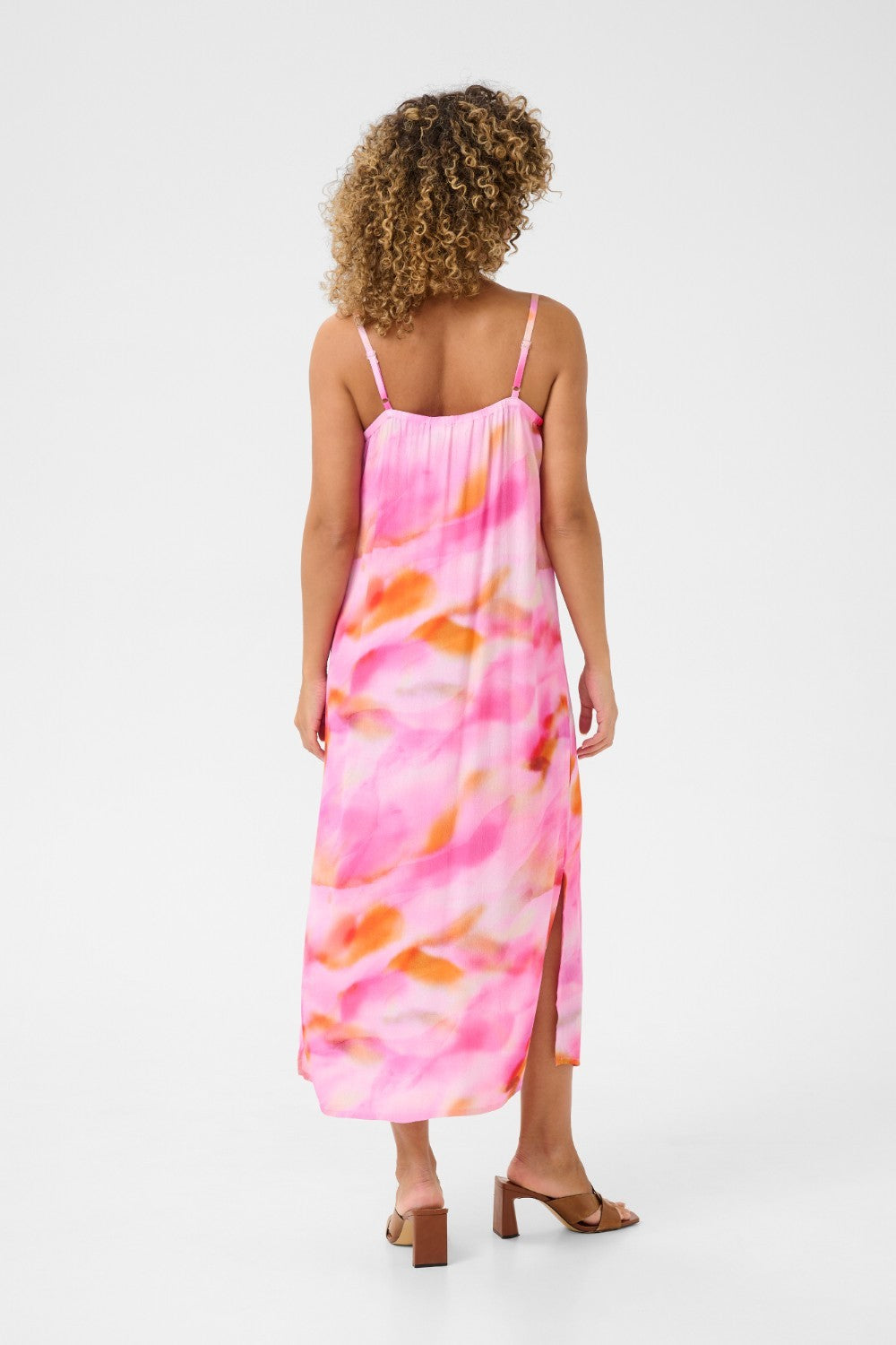 Experience cool comfort in our Cream Nana Slip Dress. This cheerful piece is perfect for any casual occasion, offering a relaxed and effortless style. Stay stylish while feeling at ease in this must-have dress.