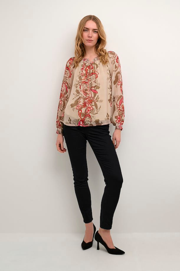 Look and feel your best in the enchanting Cream Noviba Blouse. The airy and lightweight fabric will keep you feeling comfortable and looking effortlessly stylish.