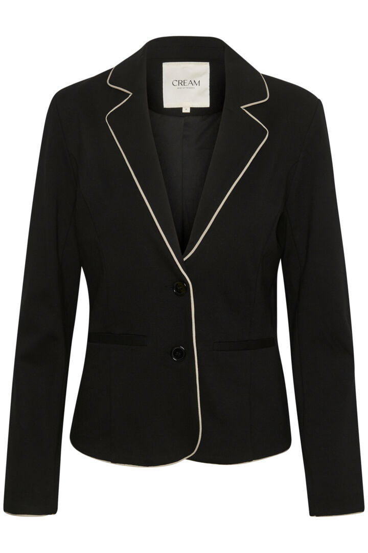 This Cream Saila Jersey Blazer boasts a timeless pitch black colour and sleek sand piping, exuding sophistication. Fully lined for comfort and durability, with a 2 button closure for a classic touch. The stretchy fabric provides a flattering fit and ease of movement, making this blazer a versatile wardrobe essential.