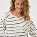 Woman wearing a striped long-sleeve shirt on a white background