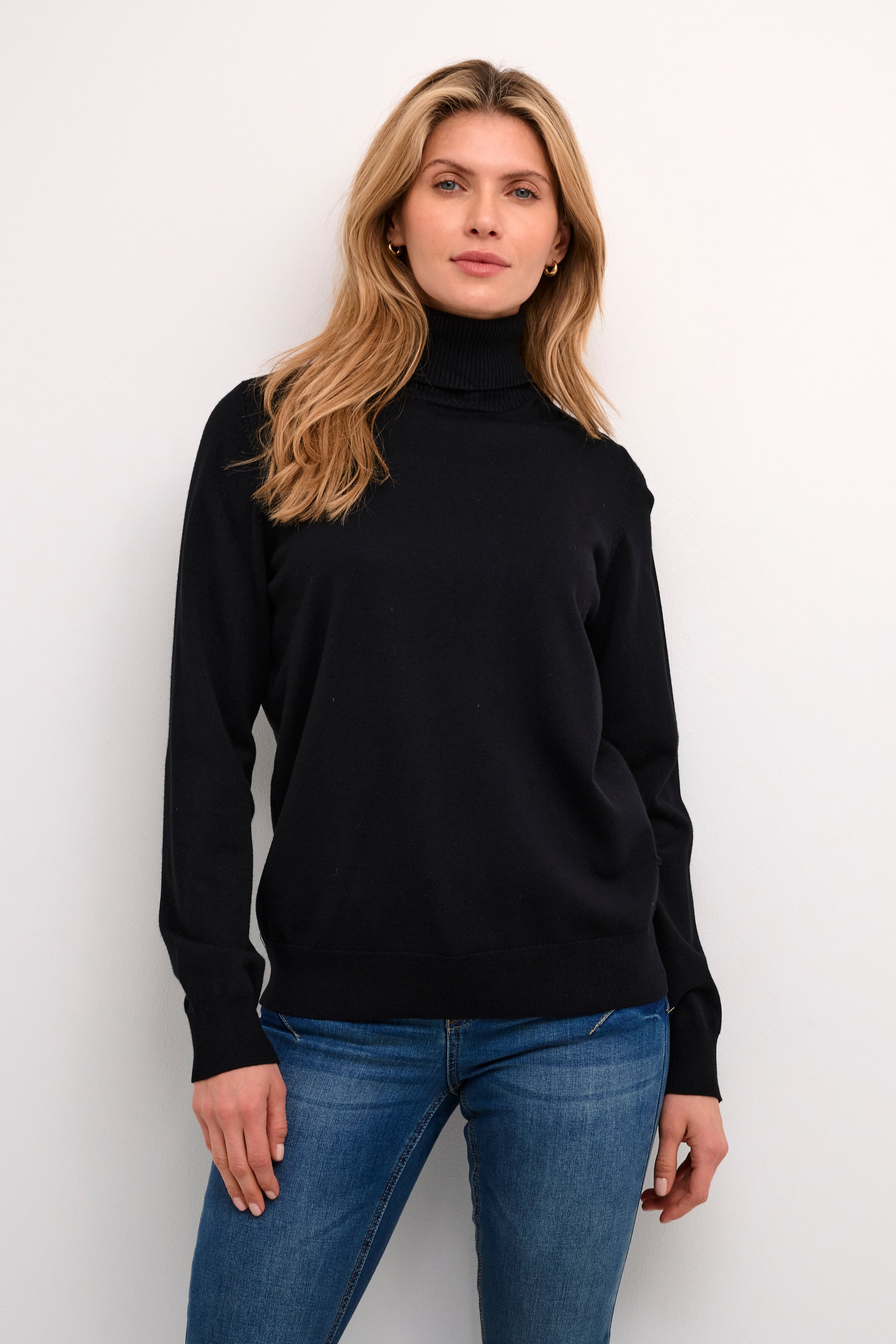 As a classic staple, the Cream Villea Knit Rollneck Sweater is perfect for layering. Crafted with high-quality materials, this versatile piece offers warmth and style for any occasion. Its timeless design makes it a must-have in any wardrobe.