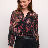 The Cream Annu Blouse - a versatile piece for any wardrobe. Add a touch of cream (err, I mean class) to any outfit. Perfect for work, play, or a combination of both. Don't be surprised if people start asking where you got it. (Wink, wink.)