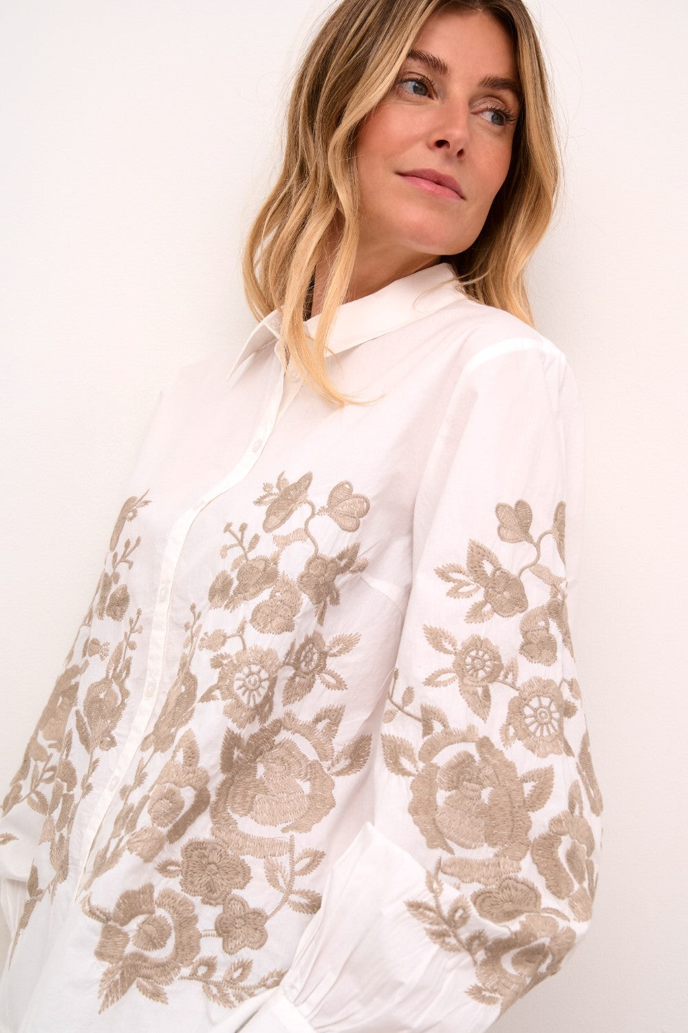 Introducing the Cream Daisy Shirt, a classic Cream style that combines timeless elegance with modern charm. Made from 100% cotton, this shirt boasts a gorgeous embroidered floral pattern that adds a touch of femininity. Perfect for most occasions, this shirt is a must-have addition to your wardrobe.