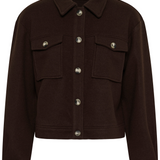 A dark brown jacket featuring a pointed collar, button-up front, and two buttoned flap chest pockets, shown on a plain white background.