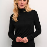 Stay cozy and chic with our Cream Amma Turtleneck. Made with soft, high-quality fabric, this turtleneck not only keeps you warm but also adds a touch of elegance to any outfit. Perfect for those chilly days when you want to make a statement (without sacrificing comfort!) Grab one now!