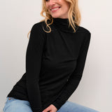 Stay cozy and chic with our Cream Amma Turtleneck. Made with soft, high-quality fabric, this turtleneck not only keeps you warm but also adds a touch of elegance to any outfit. Perfect for those chilly days when you want to make a statement (without sacrificing comfort!) Grab one now!