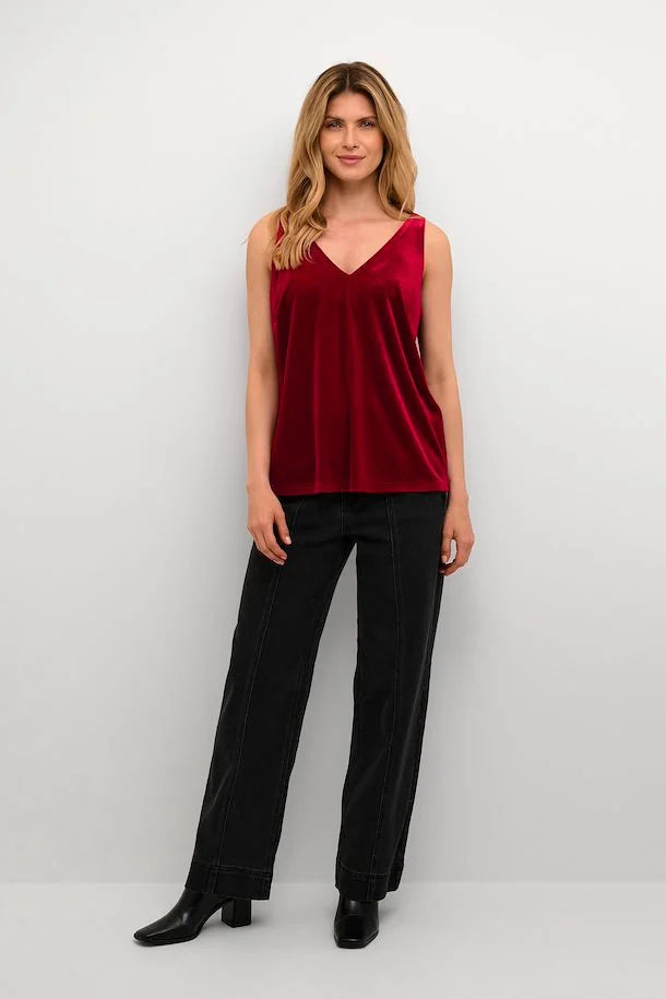 Add a pop of color to your wardrobe with this Cream Pativa Top! This stunning red velvet sleeveless top is sure to make you stand out, without taking itself too seriously. 