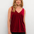 Add a pop of color to your wardrobe with this Cream Pativa Top! This stunning red velvet sleeveless top is sure to make you stand out, without taking itself too seriously. 