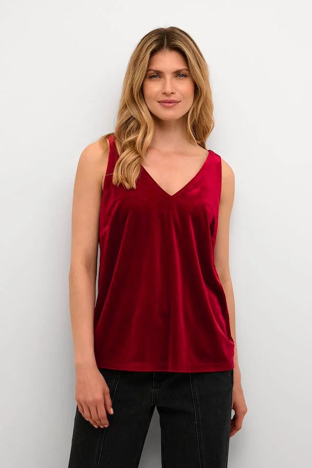 Add a pop of color to your wardrobe with this Cream Pativa Top! This stunning red velvet sleeveless top is sure to make you stand out, without taking itself too seriously. 