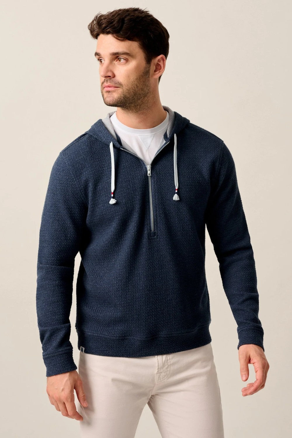 Made with our ripple knit, named for it's noticable texture, this half-zip hoodie is a formidable candidate for your new favorite layer for everything from the morning dog walk to the sports bar. Finished with high-quality hardware and an Americana-inspired red, white, and blue detail on the drawstring, this it casual style done right.