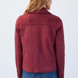 Person wearing a red jacket and blue jeans on a white background