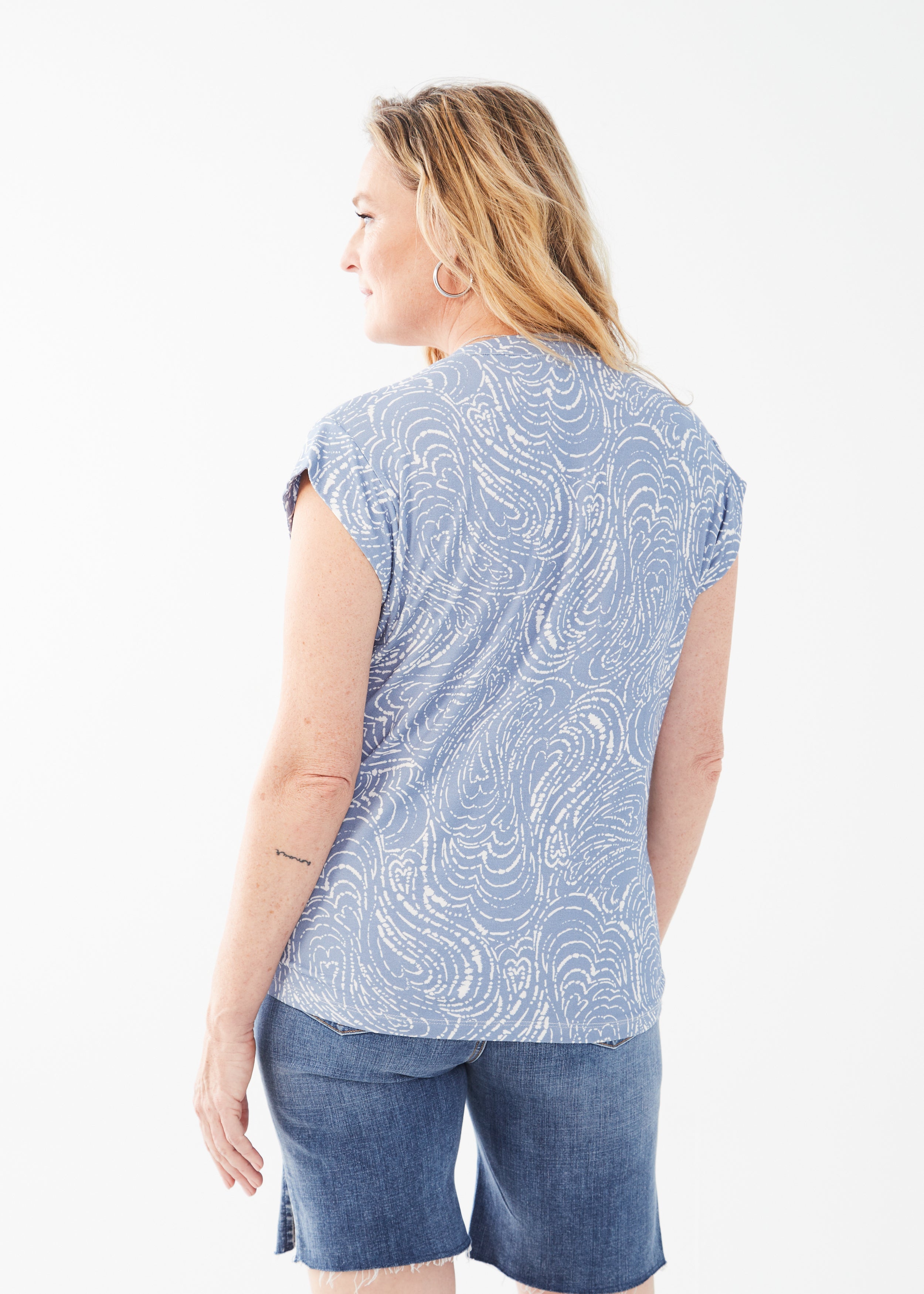Experience the ultimate blend of style and comfort with our FDJ Printed Cap Sleeve V-Neck Top! 