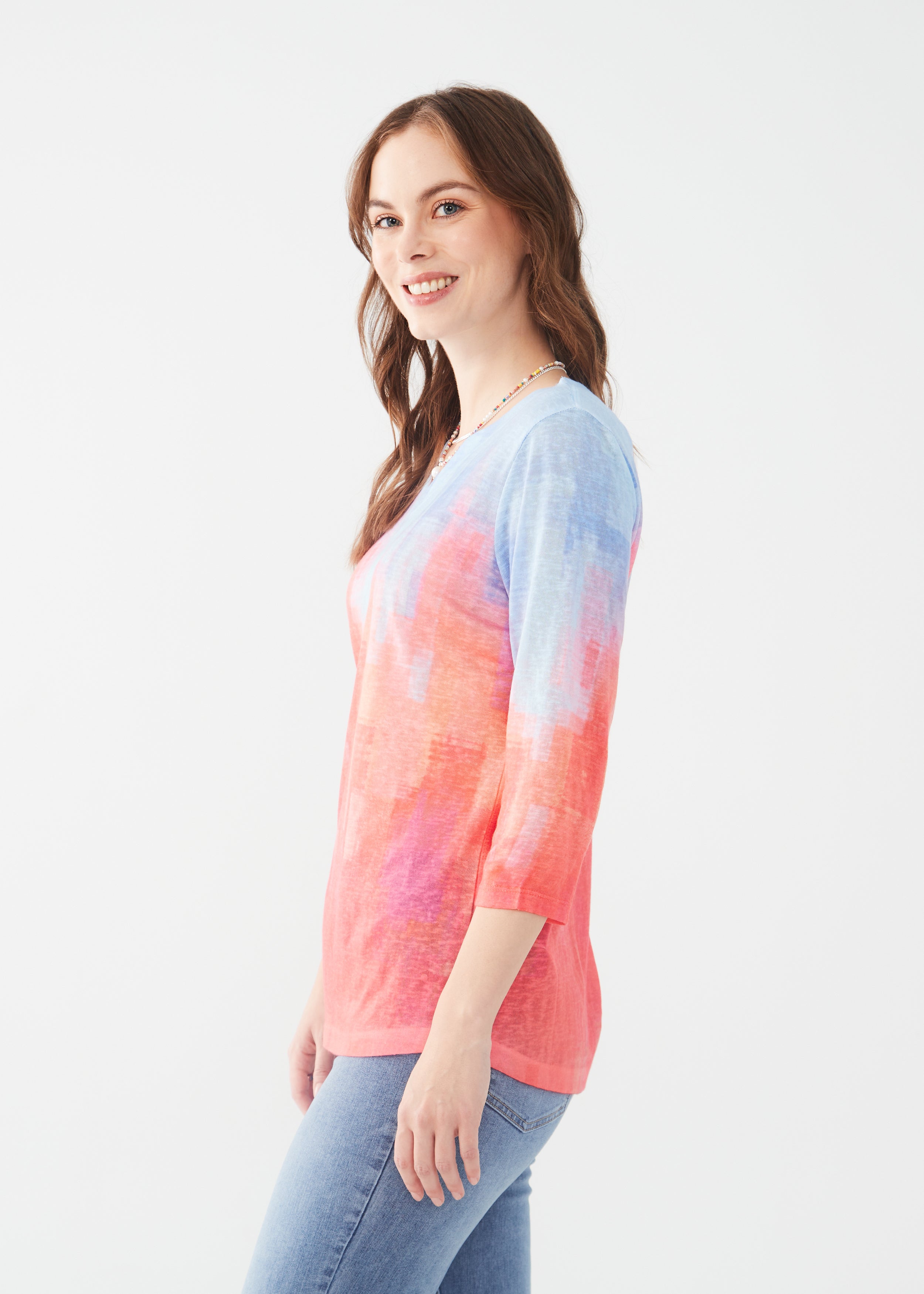 Elevate your style game with the FDJ Notch Neck 3/4 Sleeve Top, featuring a bold Flamingo Gradient design!