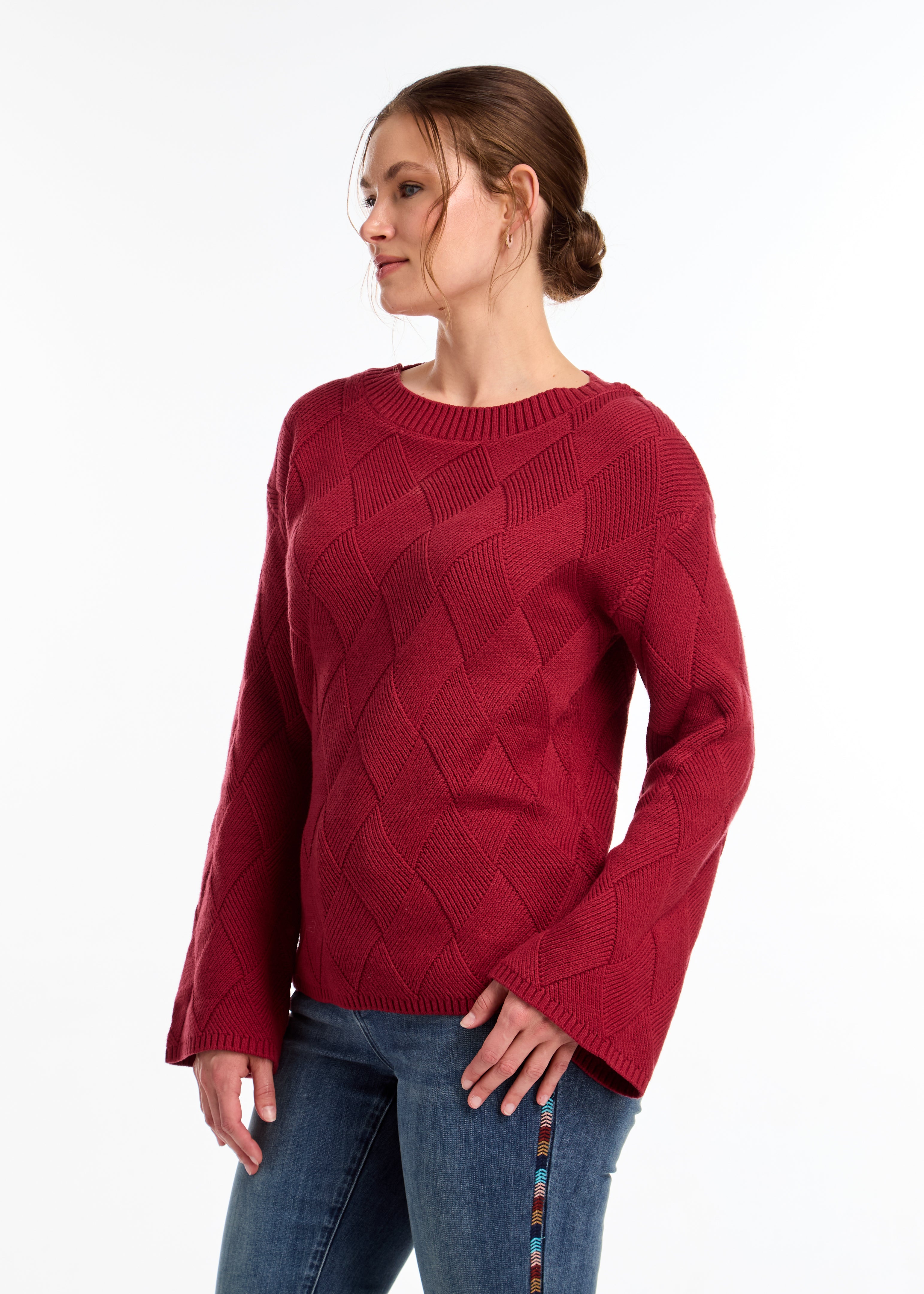 Discover the perfect blend of modern and classic with our textured knit sweater. With bell sleeves and dropped shoulders, it's a cold-weather must-have.