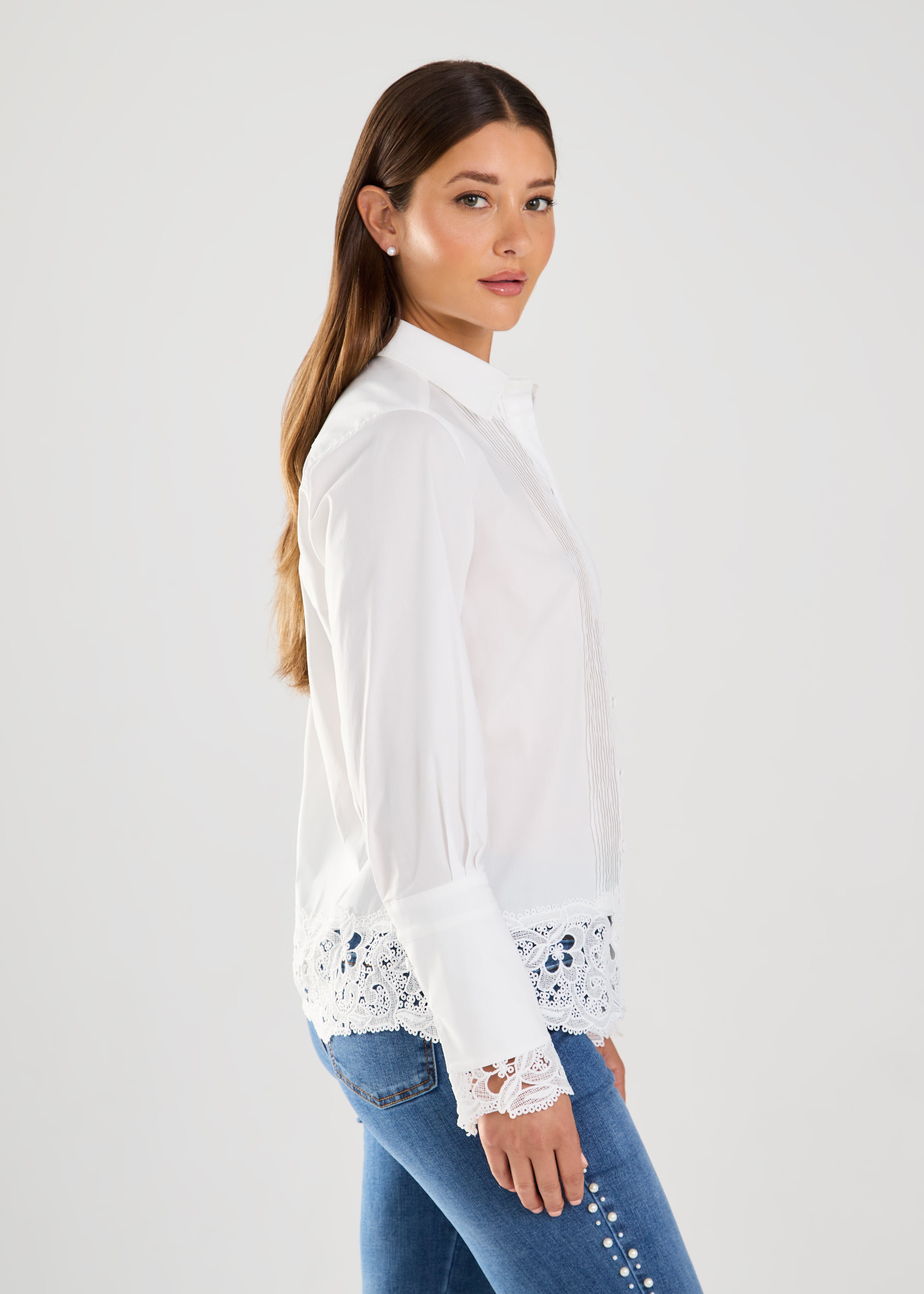 Expertly crafted with a timeless design, the FDJ Long Sleeve Lace Detail Shirt effortlessly elevates any outfit. With a perfect blend of cotton and stretch, this beautiful shirt offers both style and comfort. Perfect for dressing up or keeping casual, it's a versatile addition to any wardrobe.