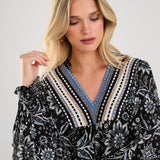 This boho blouse combines feminine flair with a touch of vintage-inspired style for a truly unique piece.