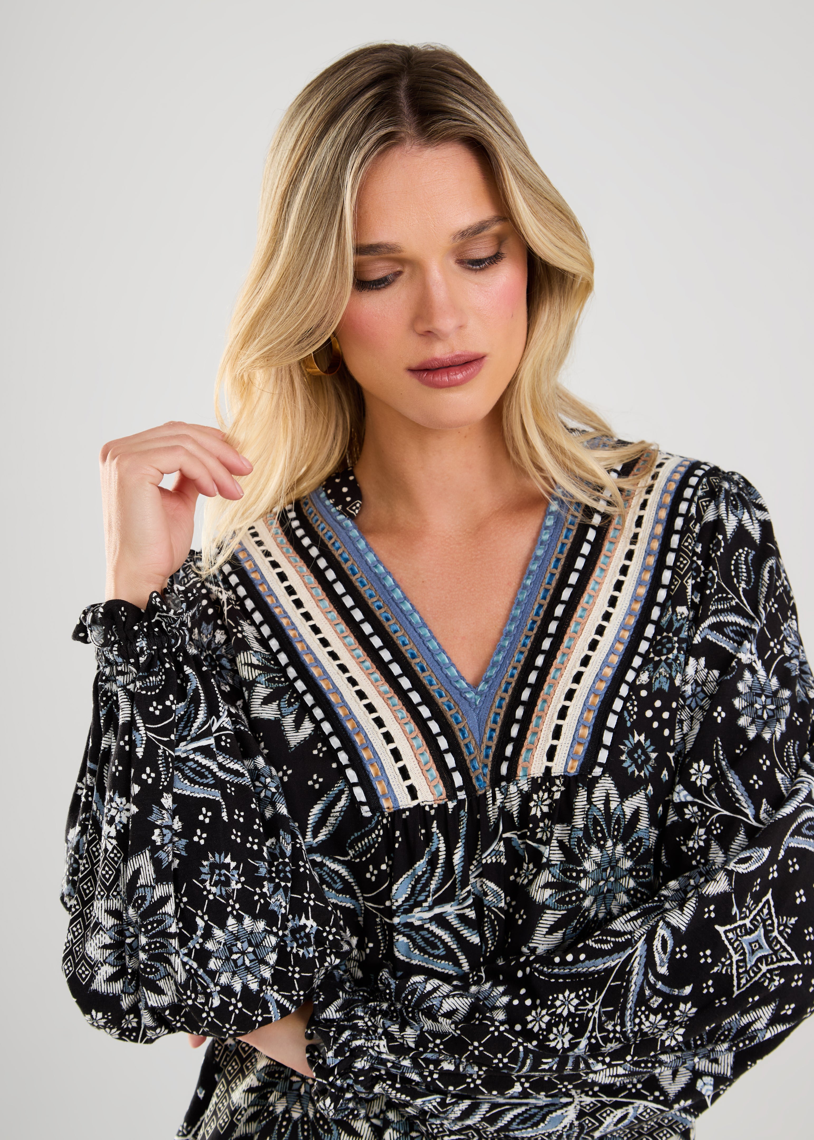 This boho blouse combines feminine flair with a touch of vintage-inspired style for a truly unique piece.