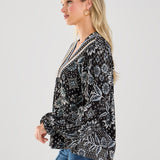 This boho blouse combines feminine flair with a touch of vintage-inspired style for a truly unique piece.