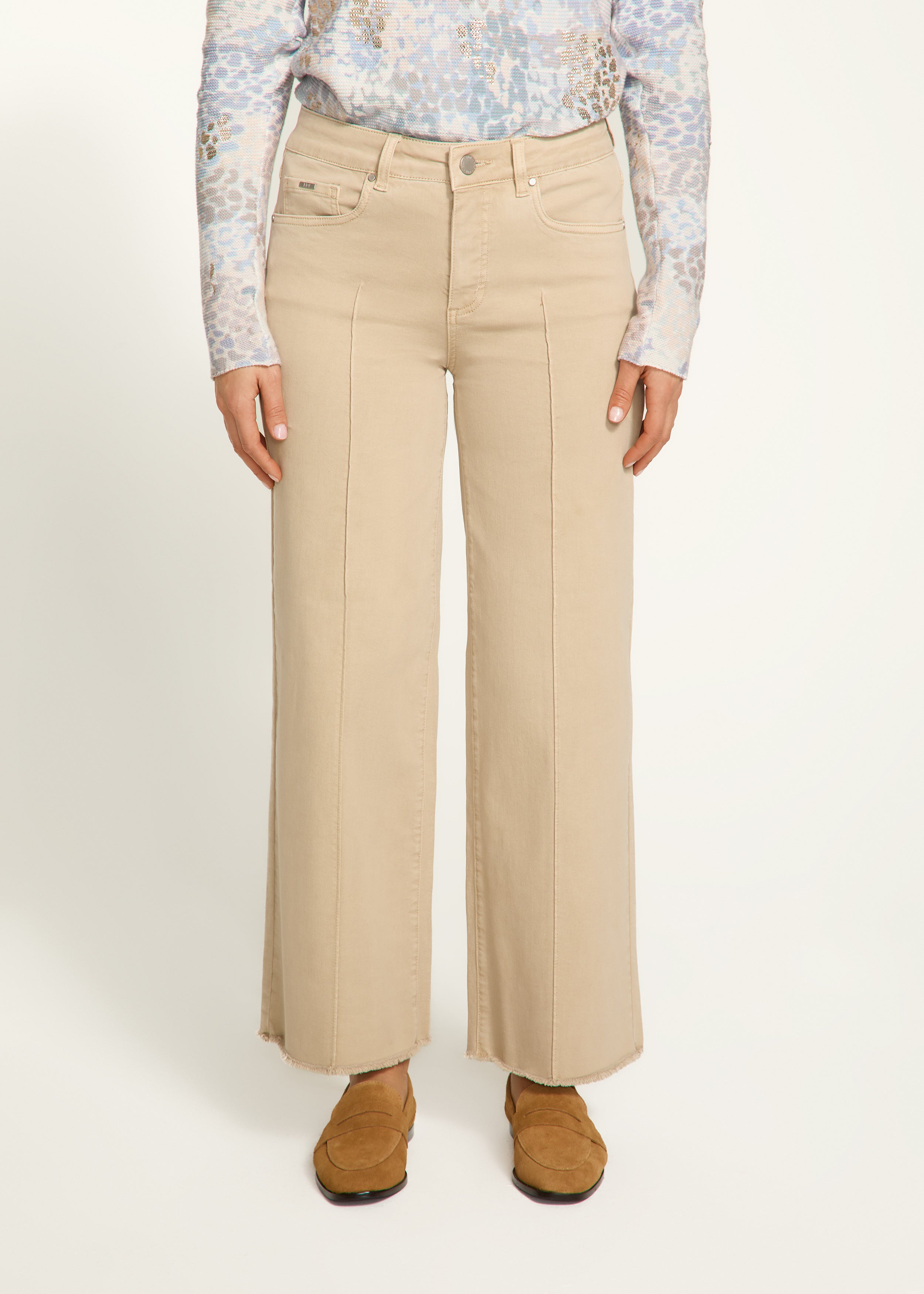 Introducing the FDJ Olivia Wide Ankle pants, designed to elevate your everyday style with its pintuck detailing and frayed bottom. These jeans are perfect for adding a touch of sophistication and edge to any outfit. Get ready to stand out from the crowd and make a statement with the FDJ Olivia Wide Ankle jeans!