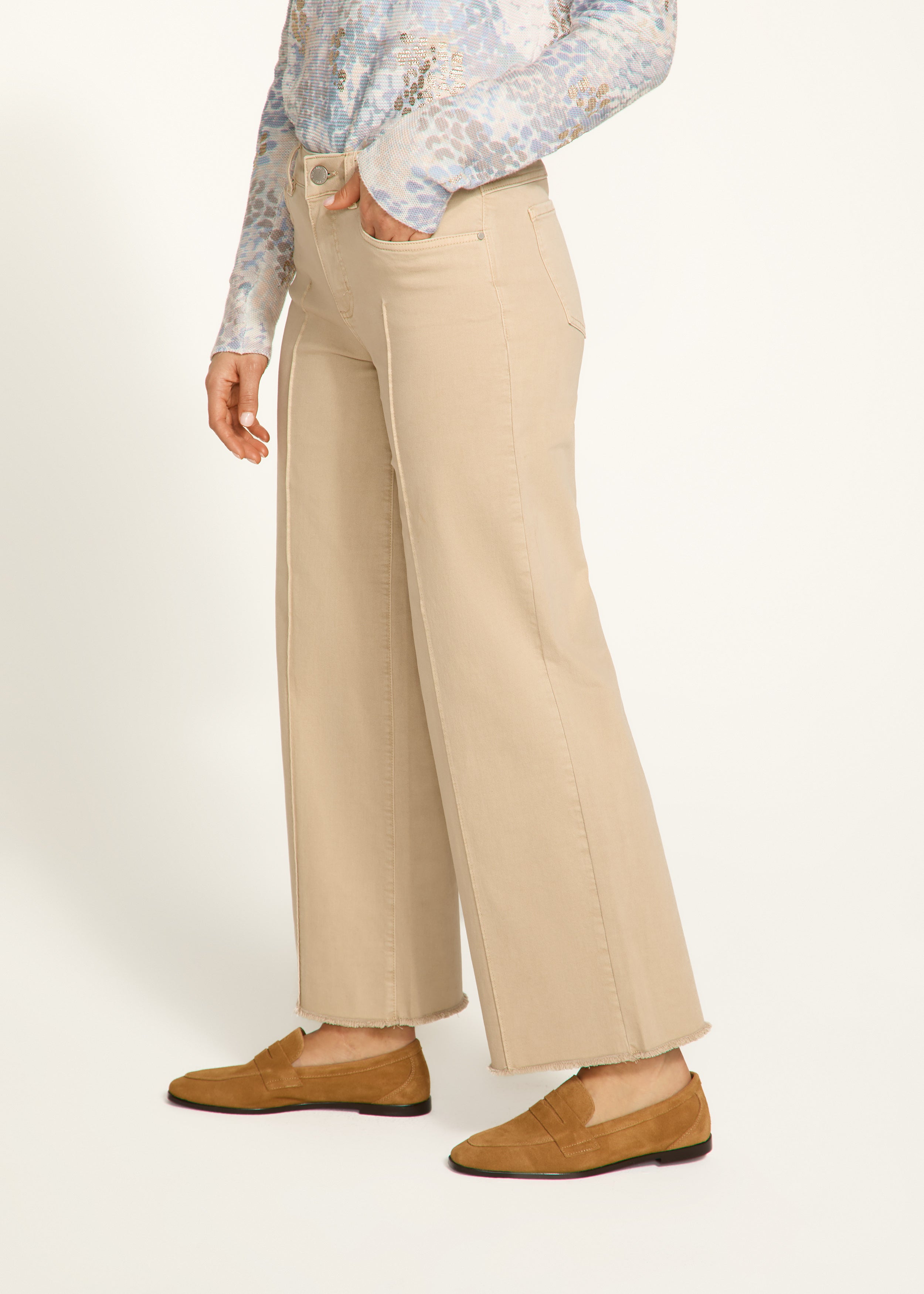 Introducing the FDJ Olivia Wide Ankle pants, designed to elevate your everyday style with its pintuck detailing and frayed bottom. These jeans are perfect for adding a touch of sophistication and edge to any outfit. Get ready to stand out from the crowd and make a statement with the FDJ Olivia Wide Ankle jeans!