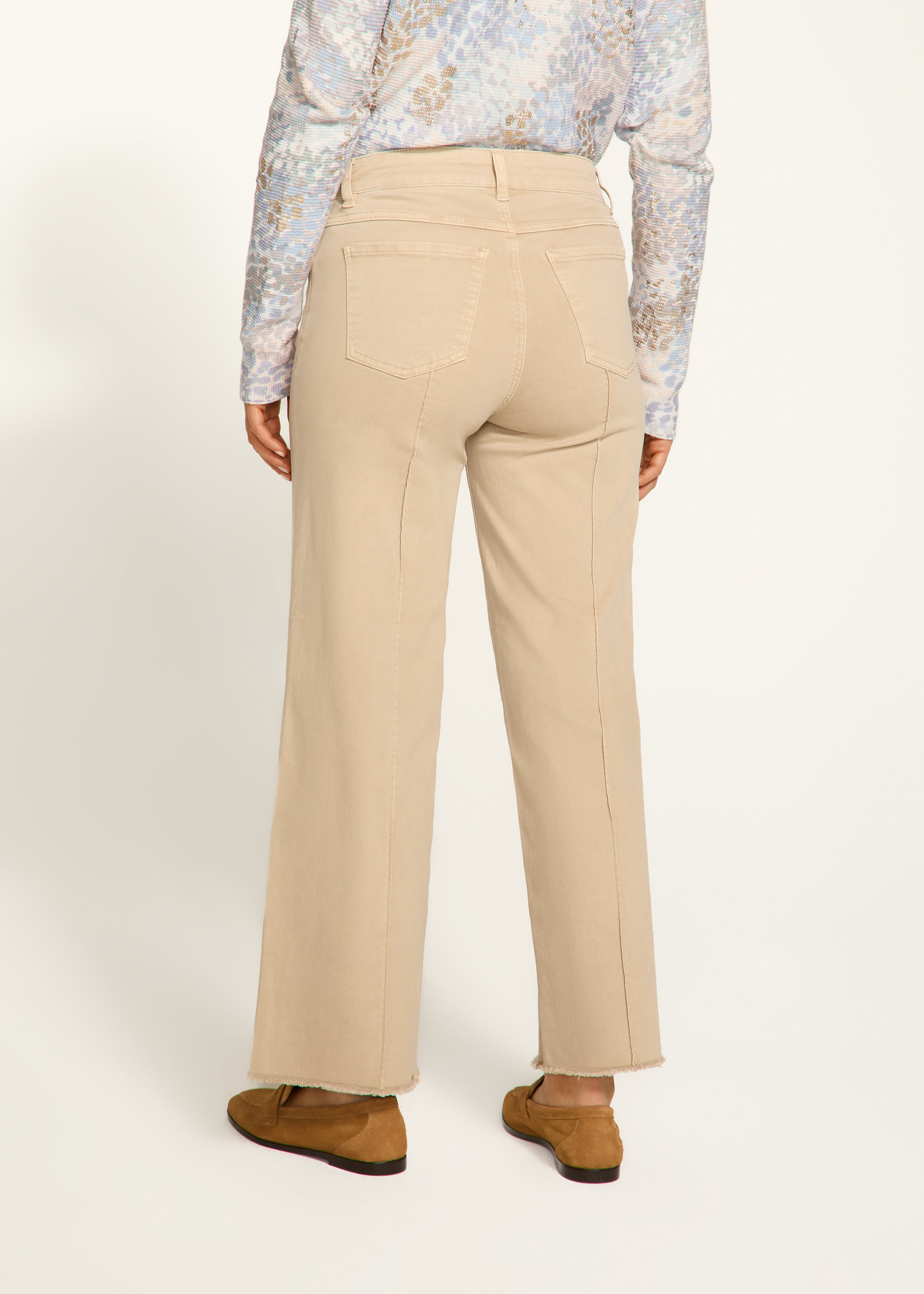 Introducing the FDJ Olivia Wide Ankle pants, designed to elevate your everyday style with its pintuck detailing and frayed bottom. These jeans are perfect for adding a touch of sophistication and edge to any outfit. Get ready to stand out from the crowd and make a statement with the FDJ Olivia Wide Ankle jeans!